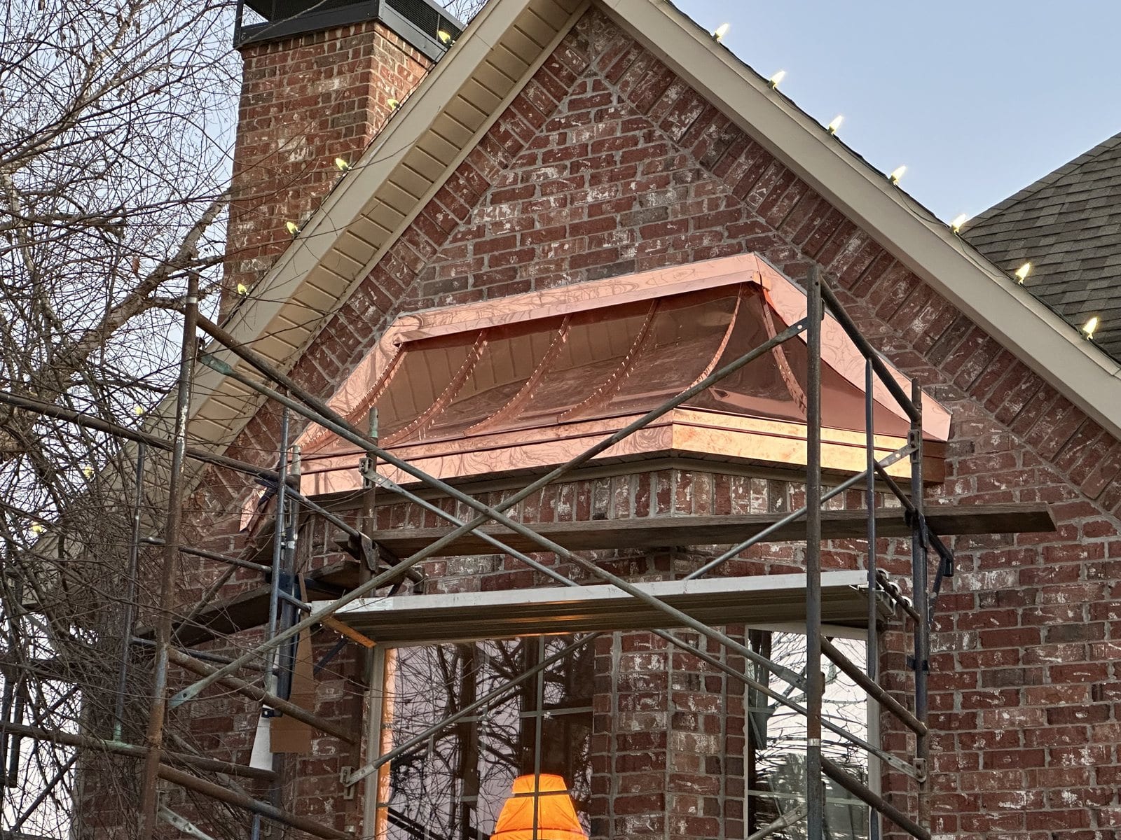 Scaffolding set against a brick gable for soffit, fascia and trim repair